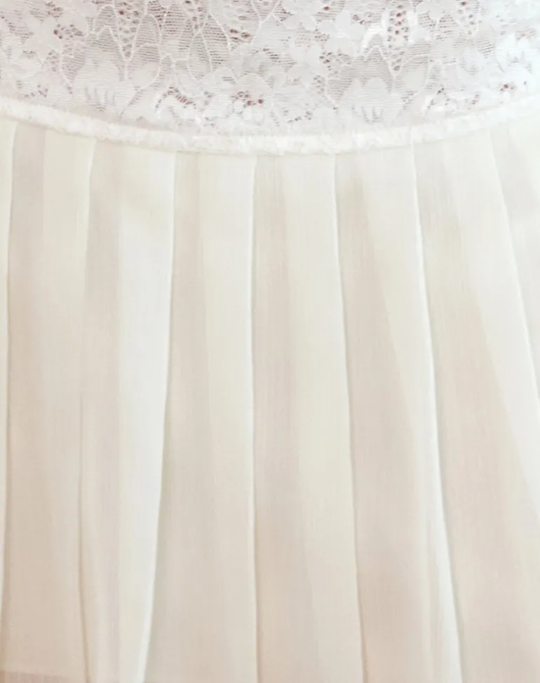 Akara Pleated Mini Skirt in Chiffon Ivory