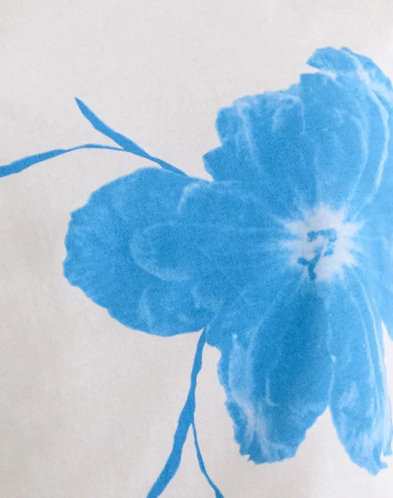 Balia Asymmetric Short Sleeve Top in Off White with Blue Flower Silhouette